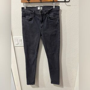 AGOLDE women's skinny denim jeans in a washed black or dark gray color